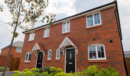 Looking up at 2 newly built homes