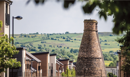 A beautiful view in Staffordshire with homes in the front and fields in the distance