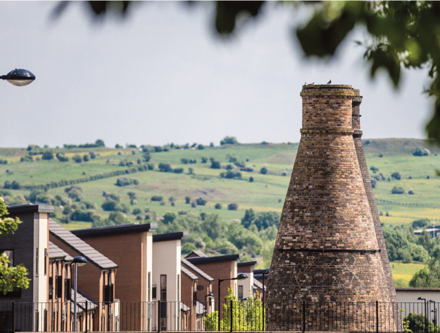 A beautiful view in Staffordshire with homes in the front and fields in the distance