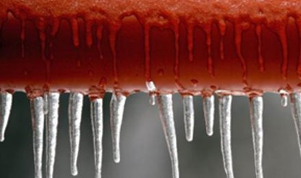 Icicles hanging off a frozen pipe