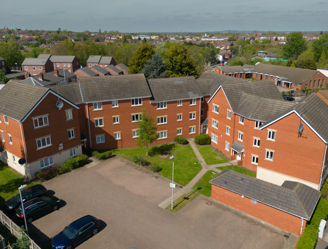 An aerial shot of various homes in the sunshine