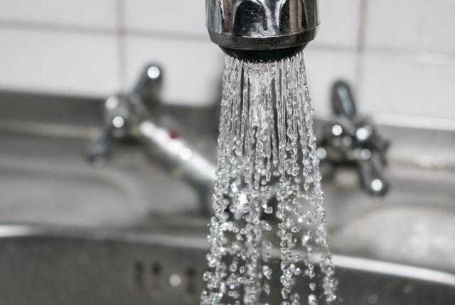 Water spraying out of a tap