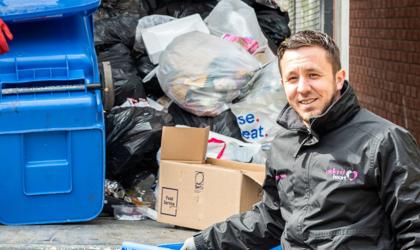 Filling a lorry with waste to be taken away