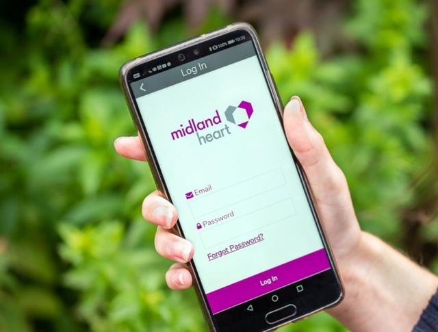 A phone showing the Midland Heart app