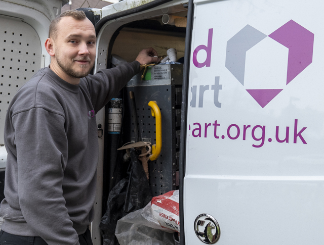 A repairs operative reaching into their van