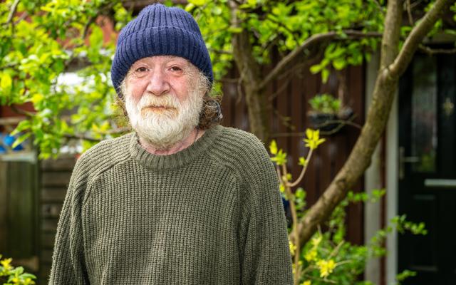 Thomas standing in his garden