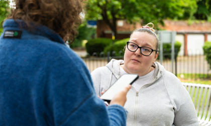 A tenant speaking to a Midland Heart employee