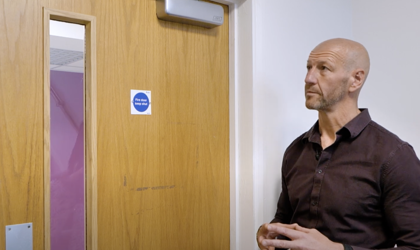 Midland Heart Employee Looking At A Fire Door