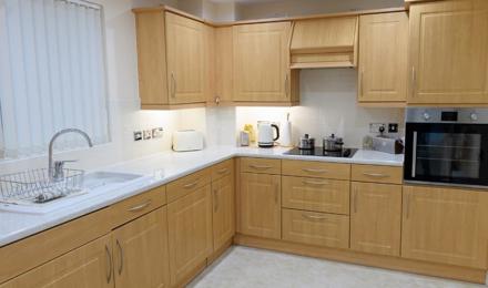 A bright kitchen with wooden cabinets