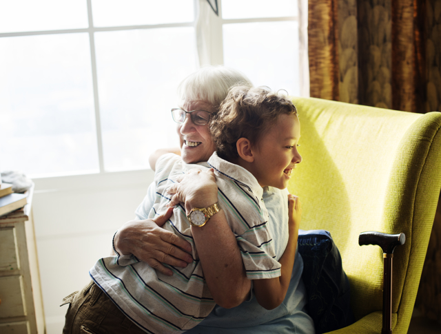 A grandma hugging her grandson