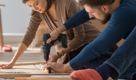 2 people carrying out home improvement work