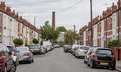 Oliver Street in Coventry, looking straight down the road with cars and houses either side