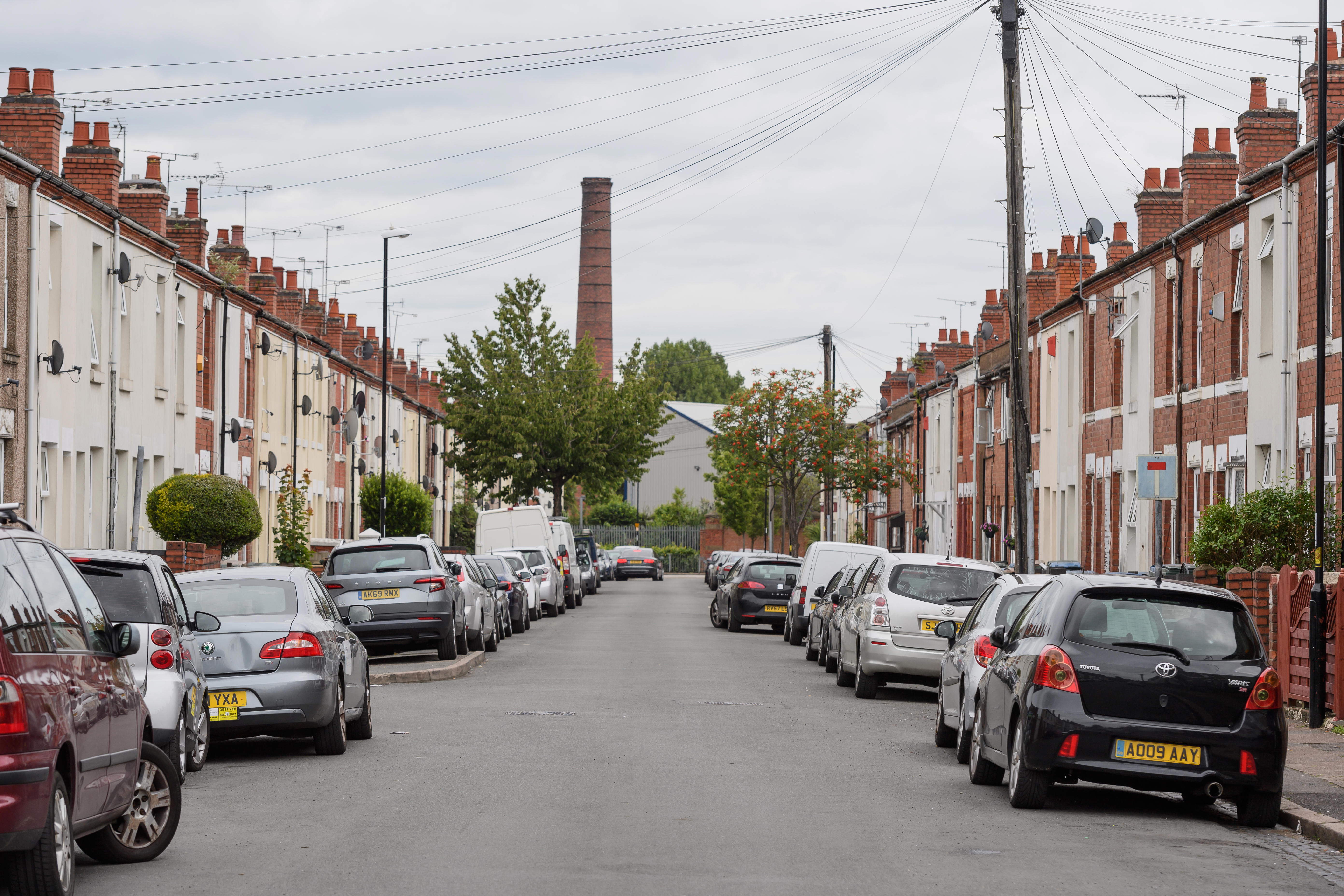 Oliver Street in Coventry, looking straight down the road with cars and houses either side