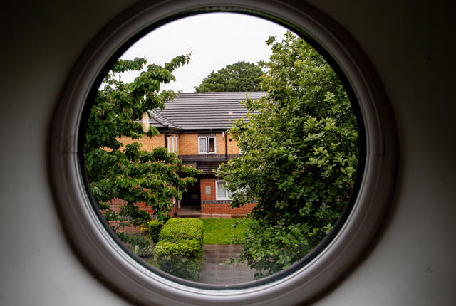 A view of Lichfield House through a circular window