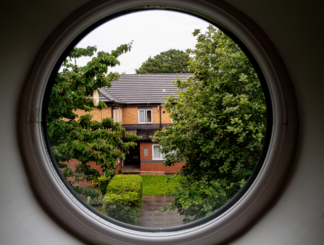 A view of Lichfield House through a circular window