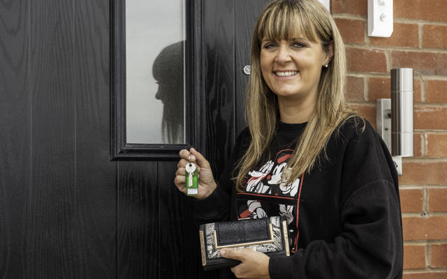 A tenant holding the keys to their new home